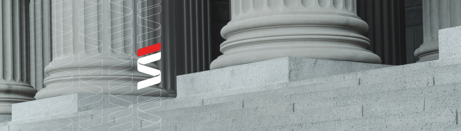 Close-up of stone courthouse columns with vertical fluting. Fraser Stryker logo pattern on the left side.