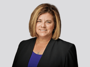 Headshot of Kristin Crone, attorney at Fraser Stryker in Omaha, NE, wearing a black suit jacket and blue shirt.