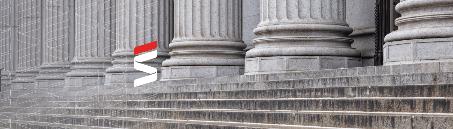 Close-up view of classical stone columns with intricate fluting details, standing on a set of wide stone steps. Fraser Stryker logo pattern on the left side.