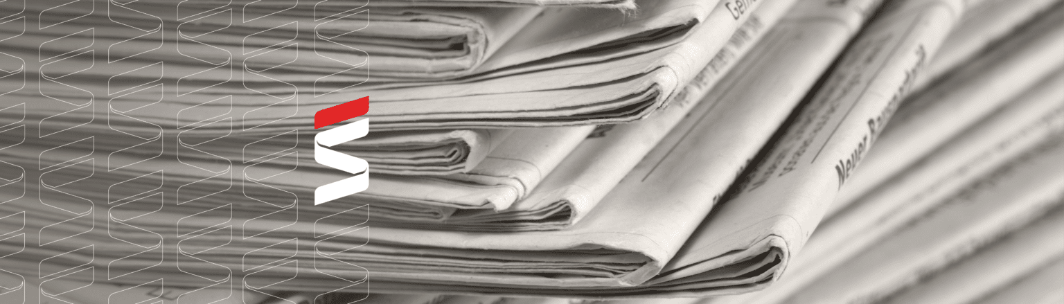 Stack of folded newspapers in black and white close-up with a blurred background. Fraser Stryker logo icons repeating on the left side of the photo.
