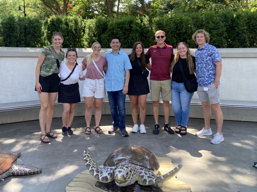 Photo of six individuals outdoors at Omaha's Henry Doorly Zoo and Aquarium