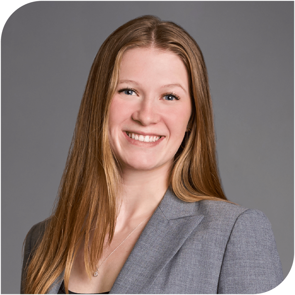 Melanie Miller, Fraser Stryker Summer Associate, wearing a dark grey suit jacket and black shirt.