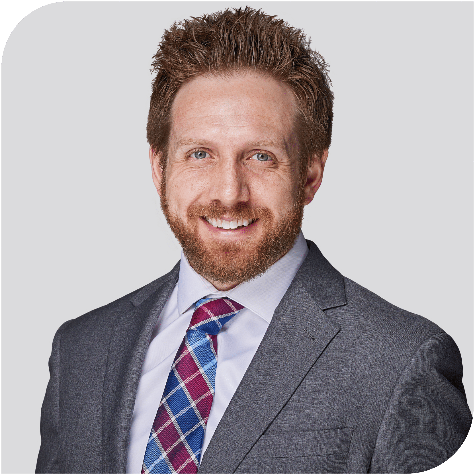 T.W. Huntington Jr., Fraser Stryker attorney, wearing a grey suit, a white dress shirt, and a red and blue tie.