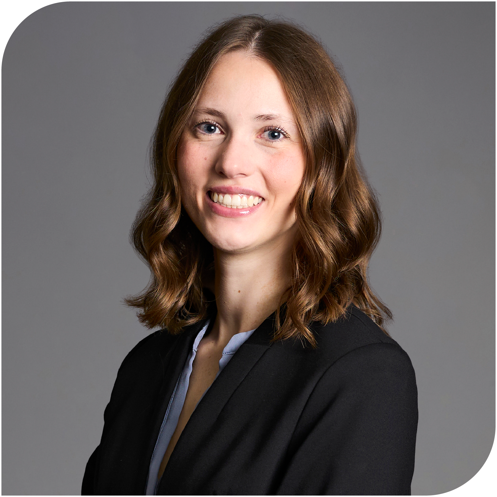 Abigail Bergstrom, Fraser Stryker Summer Associate, wearing a black jacket and a light blue button down shirt