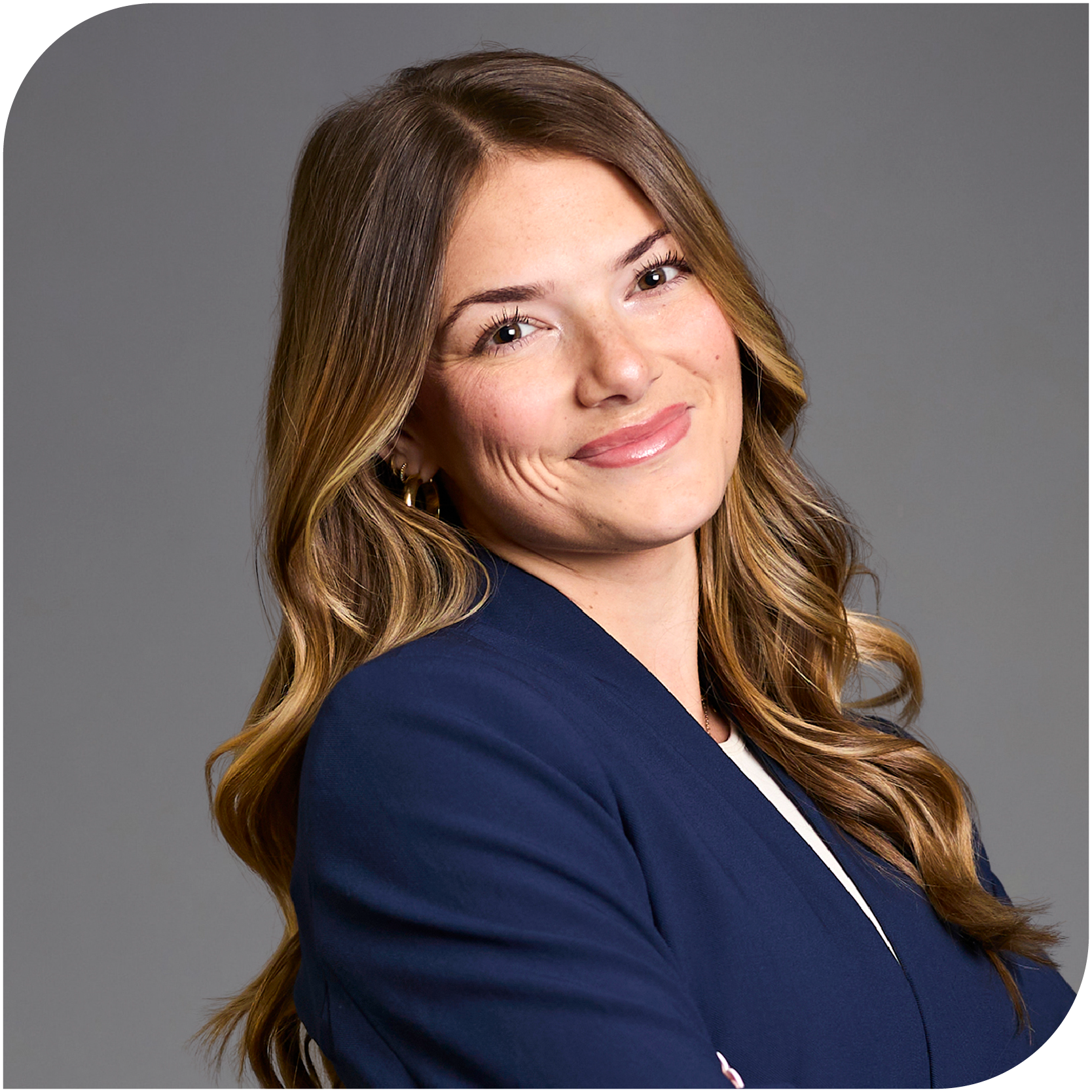 Taya Skelton, Fraser Stryker Summer Associate, wearing a blue jacket and a white shirt