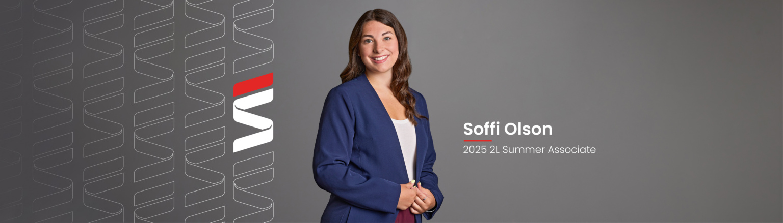 Soffi Olson, Fraser Stryker 2L Summer Associate, wearing a blue jacket, a white shirt, and maroon pants. Fraser Stryker logo pattern on the left side.