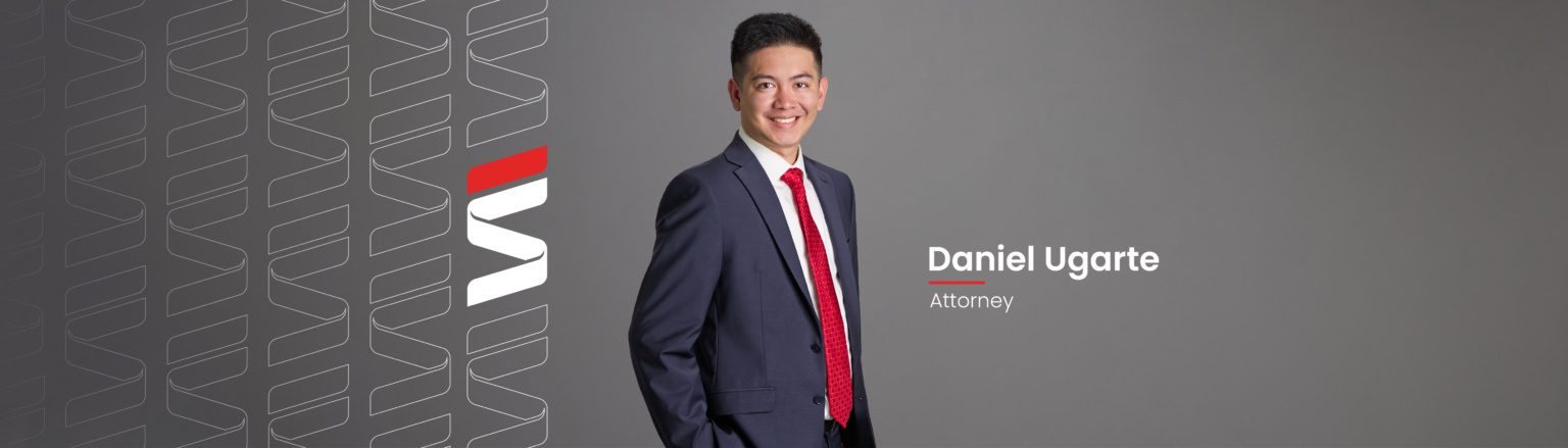 Daniel Ugarte, Fraser Stryker attorney, wearing a navy blue jacket, red patterned tie, and white shirt.