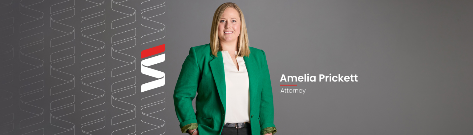 Amelia Prickett, Fraser Stryker attorney, wearing a green jacket and white shirt shirt. Fraser Stryker logo pattern on the left side.