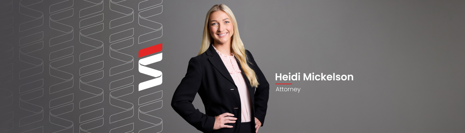 Heidi Mickelson, Fraser Stryker attorney, wearing a black suit jacket and a pink shirt. Fraser Stryker logo pattern on the left side.