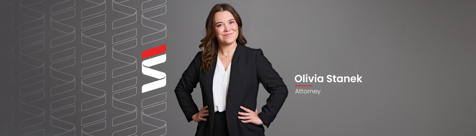 Olivia Stanek, Fraser Stryker attorney, wearing a black suit jacket and a white shirt. Fraser Stryker logo pattern on the left side.