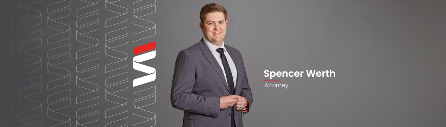 Spencer Werth, Fraser Stryker attorney, wearing a grey suit jacket, white shirt and black tie. Fraser Stryker logo icon repeating on the left side of the photo.