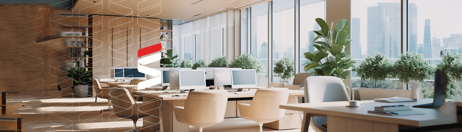 Photo of office with multiple computer work stations. Fraser Stryker logo icon repeating on the left side of the photo.