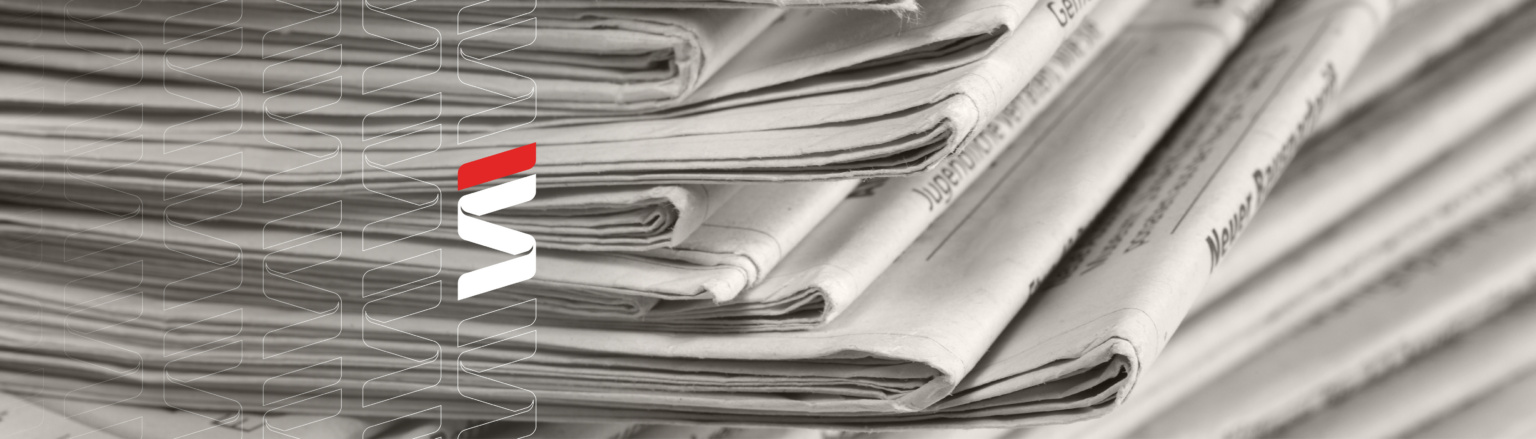 Stack of folded newspapers in black and white close-up with a blurred background. Fraser Stryker logo icons repeating on the left side of the photo.
